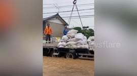 Homes submerged in knee-deep flood after Typhoon Nepartak batters Japan
