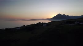 Sunset with the Cuillin mountain range in the foreground. Elgol, Isle of Skye.