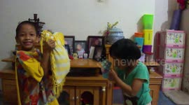 Kids Learning Kick Boxing Trained by Their Uncle Using Pillow and Glove