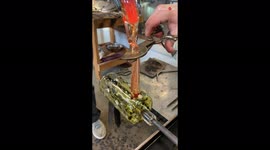 Super-satisfying footage shows craftswoman finishing glass beer mug