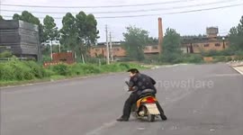 Angry bird attacks moped drivers in China