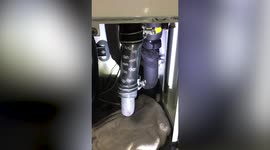 Bizarre moment snake was seen slithering through clear air conditioner pipe