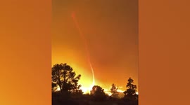Rare fire tornado emerges as Tamarack Fire rips through hillside in California