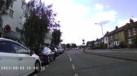 A near miss when a car driver nearly wipes me and my bike out by opening his door on me.