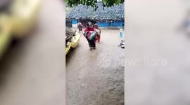Locals cling onto tree all day to survive flash floods in central India