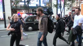 Cameraman attacked by anti-vax protestors in London