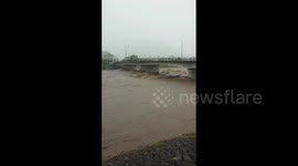 Japan: Vehicles Stranded In Swollen River As Heavy Rains Lash Kyushu