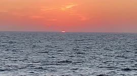 Watch beautiful sunset from the boat on the North Pacific Ocean