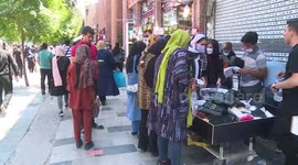 Commerce in the streets of Tehran, Iran continues despite a spike in coronavirus cases