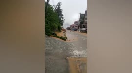 Torrents of muddy water flow from hillsides during monsoon season in the Philippines