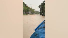 Thrill-seeker rides jet ski on flooded road after heavy rain in Thailand