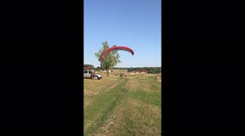Paraglider flying with motor, landed in lake