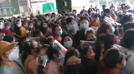 Residents rush for COVID-19 vaccines a day before scheduled lockdown in the Philippines