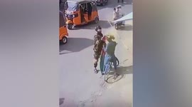 Taliban fighter attacks man wearing Afghan flag