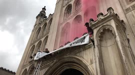 Watch moment Extinction Rebellion protesters climb London Guildhall's facade and light flares