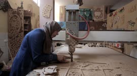 Woman from Gaza works with wood drilling machines despite having disabilities