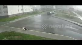 Girl on roller skates battles FIERCE wind blasting Minsk, Belarus