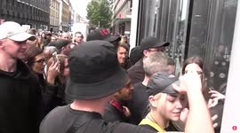 Police officers struggle to hold back influx of anti-vaxxers pouring into ITN building