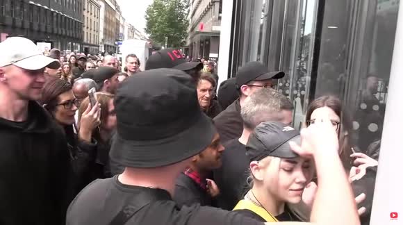 Police officers struggle to hold back influx of anti-vaxxers pouring into ITN building