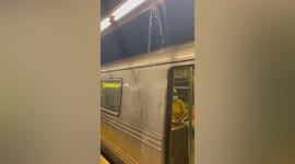 Water pours on Brooklyn subway train during Tropical Storm Henri