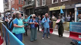 Extinction Rebellion Protestors play drums on St Martin's Lane, Covent Garden, London
