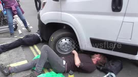 Climate change protesters chained them self's under a lorry  Excitation Rebellion