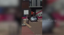 Police arrest semi-naked man by pulling him down from a car in Birmingham
