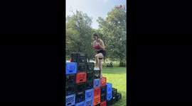 'Girl's Hopes of Winning $500 Come CRASHING DOWN with her as Crate Tower Collapses'