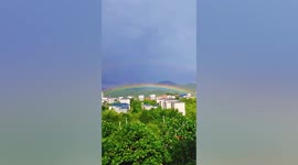 Beautiful double rainbow appears over village in China