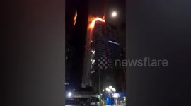 Fire spreads through under-construction office block in Bangkok