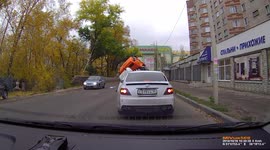 Concrete mixing truck swallowed by sinkhole as it drives on a road in Voronezh, Russia