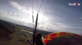 Close call! Watch the scary moment two paragliders collide in mid-air in Germany