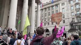 Extinction Rebellion protesters rally outside the Bank of England