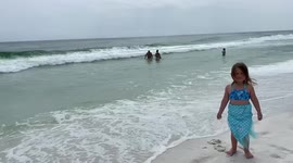 Lil toddler is happy to be at the beach in destin