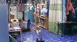 Excited one-year-old toddler does flip and falls down steps while trying to hug father