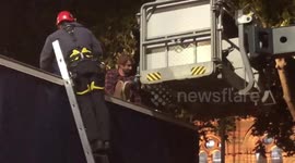 Extinction Rebellion protester who glued himself to a lorry is arrested by police in London