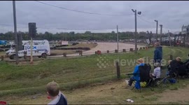 Vans banger racing around the track very fast
