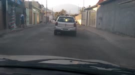 WTF MOMENT: Careless driver randomly stops in middle of the road and almost reverses into another car