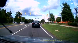 HIT AND RUN: Silver Camaro took an extremely wide turn and crashed into a parked SUV