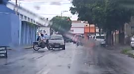 WTF MOMENT: Biker doesn't check both ways before crossing and gets caught on slow passing car (Dashcam Video)