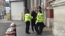 man arrested out side Smithfield Market London met police animal rebellion.