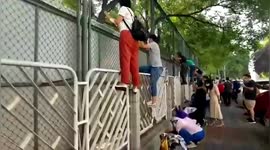 Chinese parents climb guardrails to get glimpse of their children on first day of school