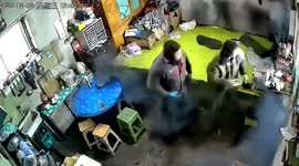 Two Chinese men get out of bed synchronously as smoke comes out