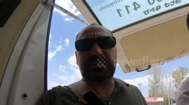 Moment a massive bear was rescued after becoming trapped in a net hidden in a tree