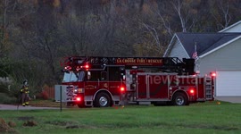 Side View of a Fire Truck in the evening on the southside of La Crosse Wisconsin responding to a medical emergency in a house.