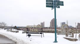 Mill ruins park in downtown Minneapolis right next to the Stoneridge bridge in the middle of winter covered in snow
