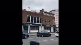 Shocking footage shows moment woman jumps on ROOF of stranger's car before FALLING off into the road
