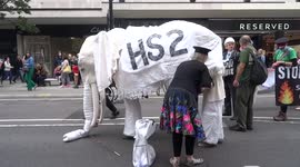 HS2 white elephant gets shoes laced up as March for Nature proceeds along Oxford Street - London