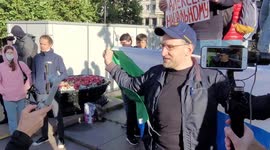 Protester speaks in support of Alexei Navalny at a rally in support of the media