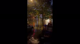 Traffic light patrols a flooded street in Hoboken, NJ, USA